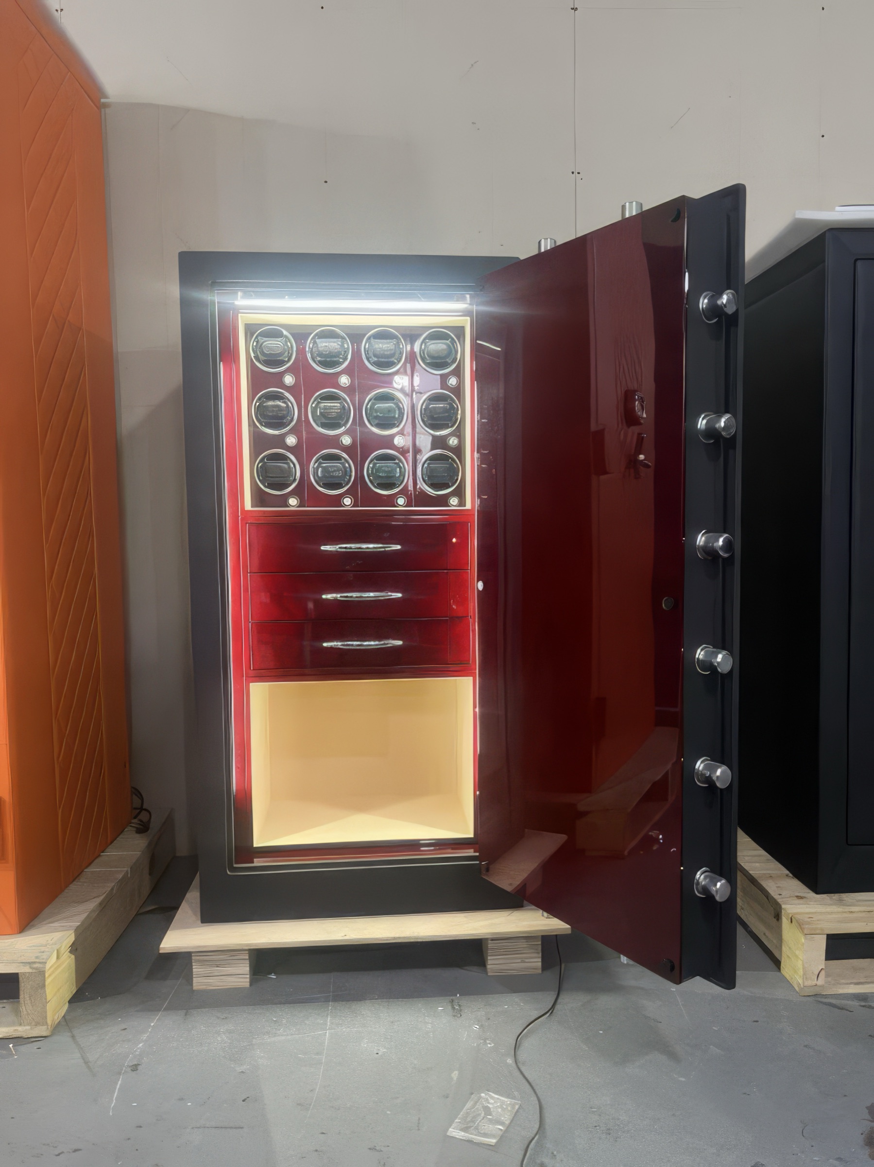 Kronberg Standard Safe in crimson and champagne with anthracite exterior and champagne leather interior — Geneva 2025